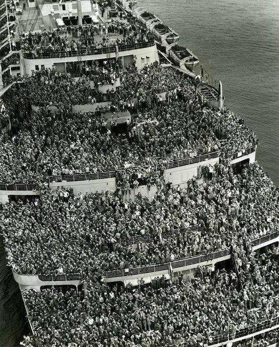 Attached picture The liner Queen Elizabeth bringing American troops into NY Harbor at the end of WWII, 1945.jpg